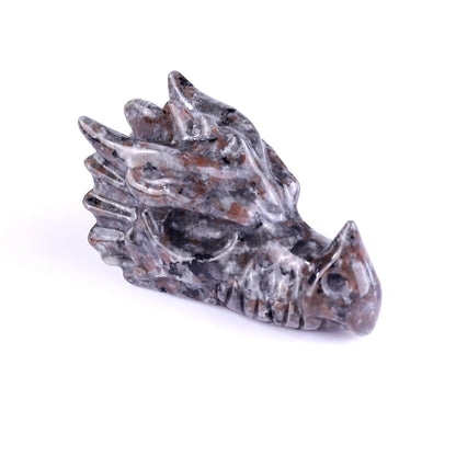 Natural Dragon Blood Jasper hand carved dragon bone skeleton sculpture white background